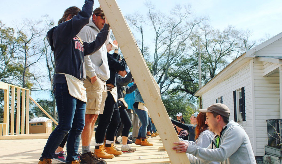 Habitat for Humanity students building house
