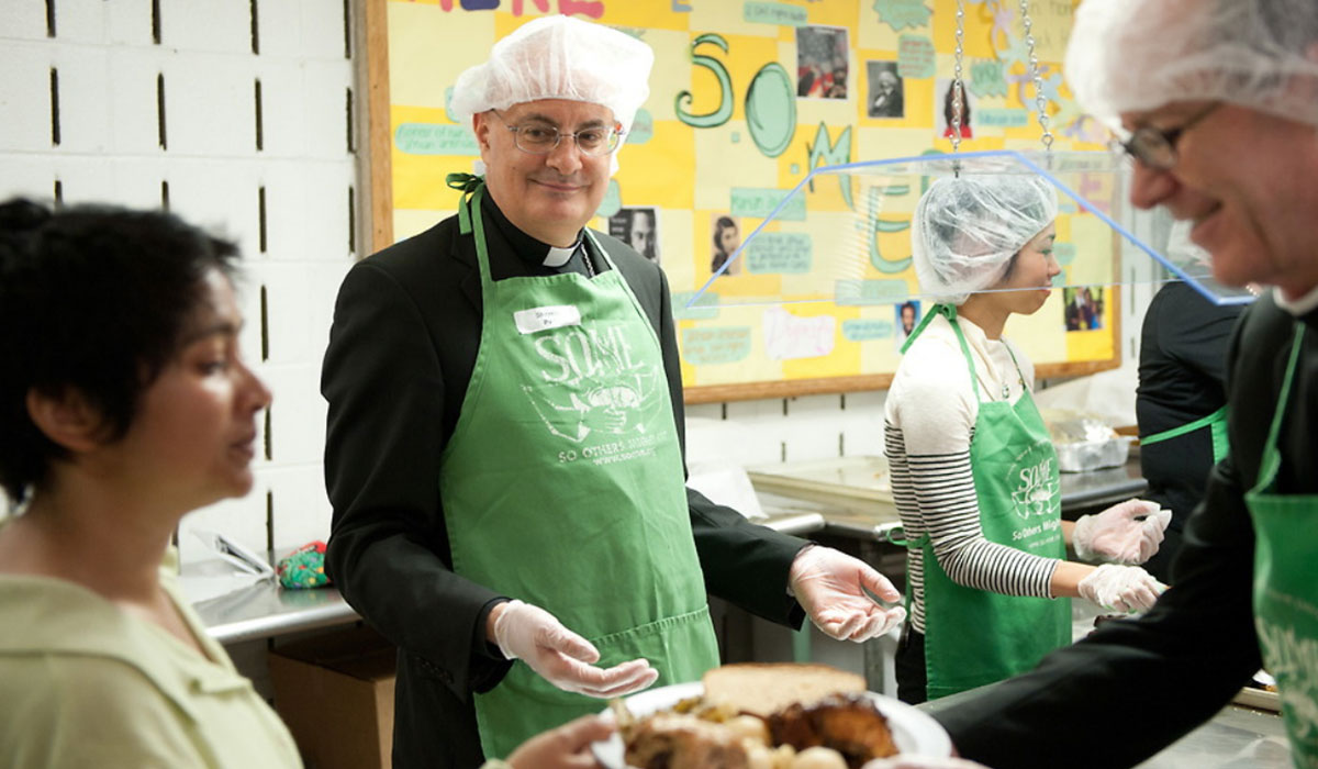 Priests serving food