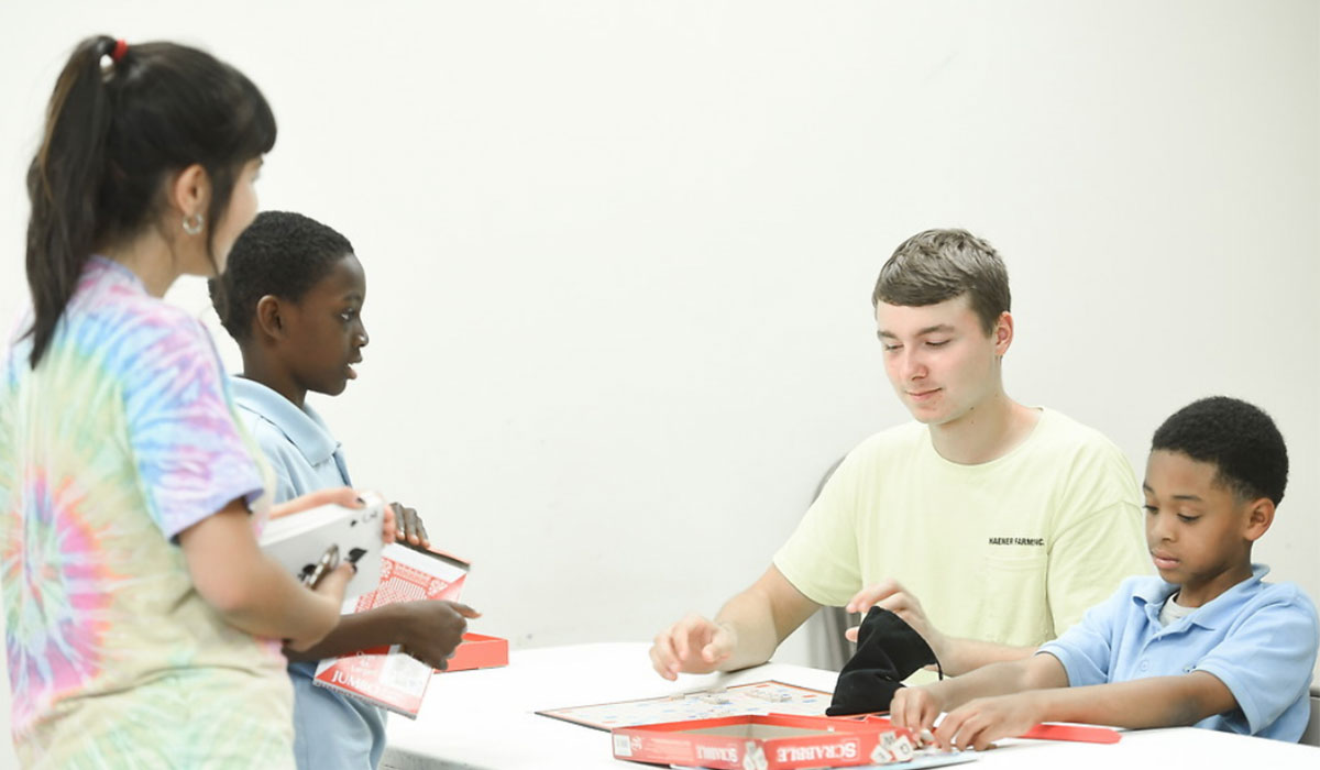 Catholic University student running a tutoring session