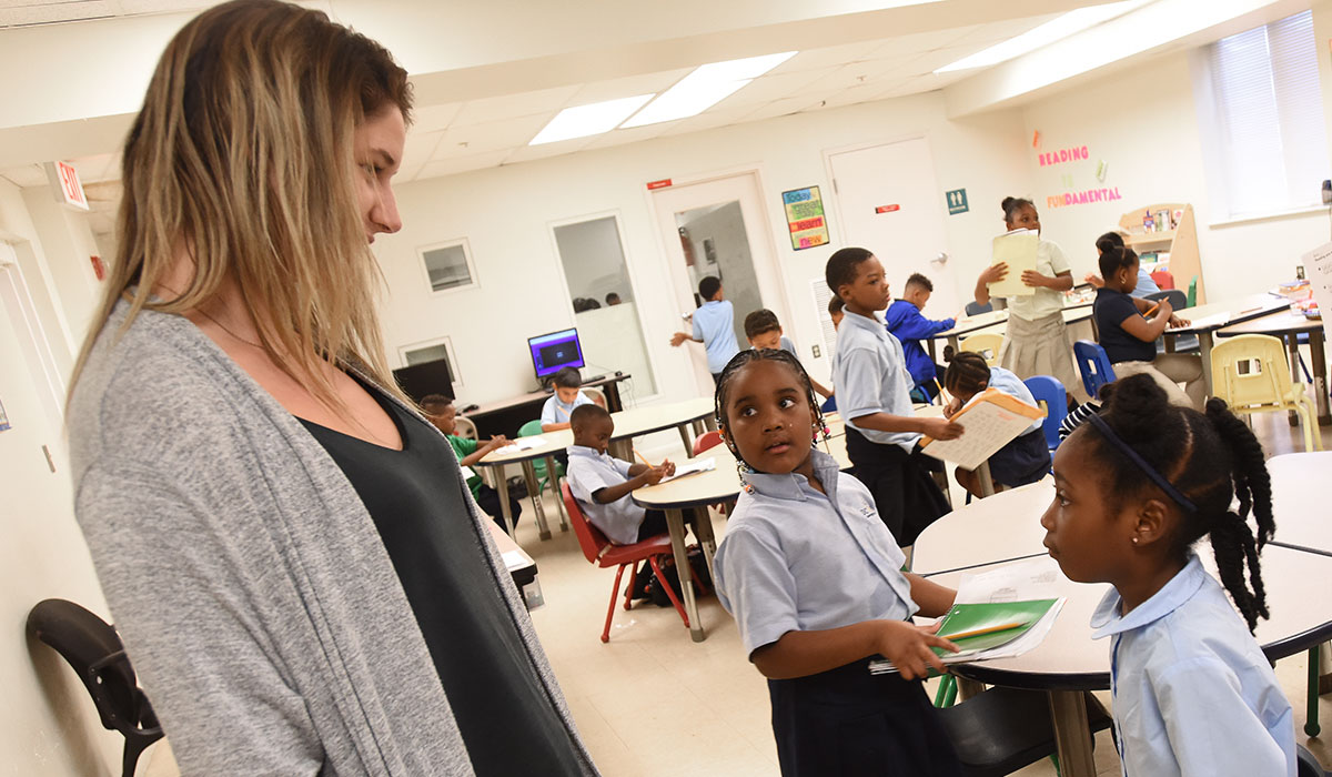 Catholic University student in a class room at St. Anthony's