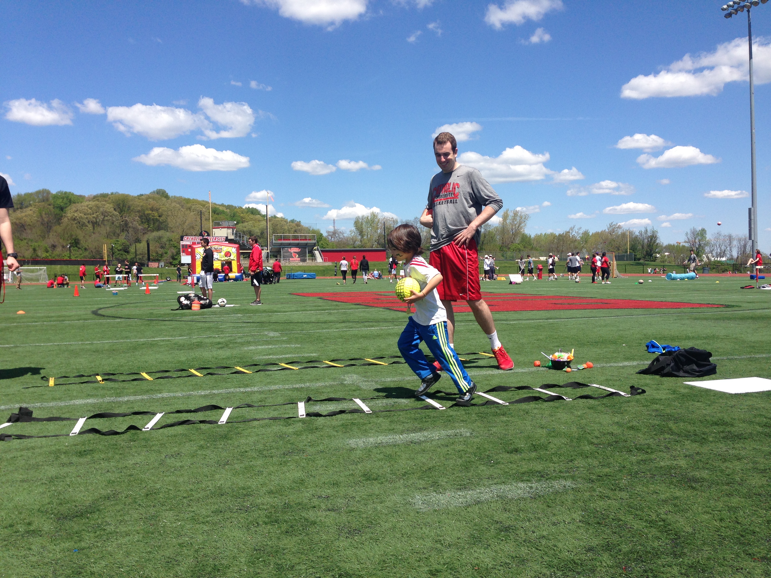 Picture of child running through a football activity